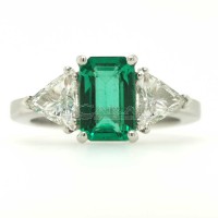 Ring with octagonal cut emerald and diamonds