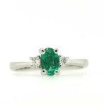 Oval cut emerald and diamond ring