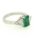 Ring with octagonal cut emerald and diamonds